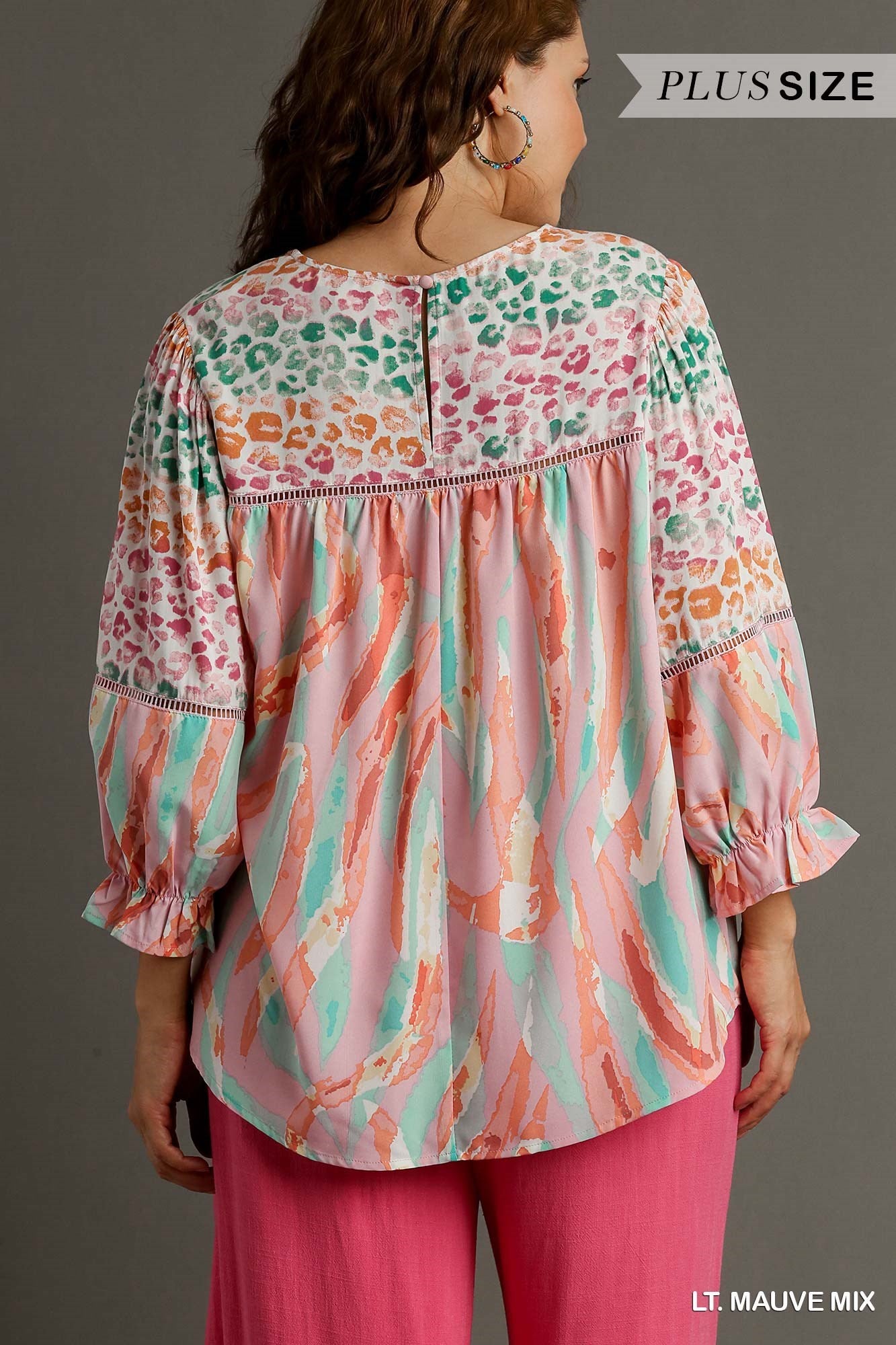 Mixed Print Top with 3/4 Sleeves and Lace Trim. Features Open Split Back Details with Button Closure