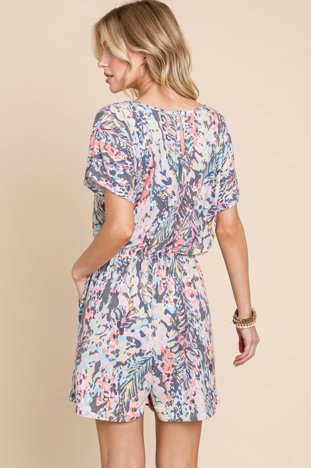 Product details Floral Printed Romper Short sleeves Round neckline Button in the back Elastic Waist Band with string straight hem at bottom Fits true to size *Colors may vary slightly due to monitor resolution and lighting* Southern Bliss Boutique