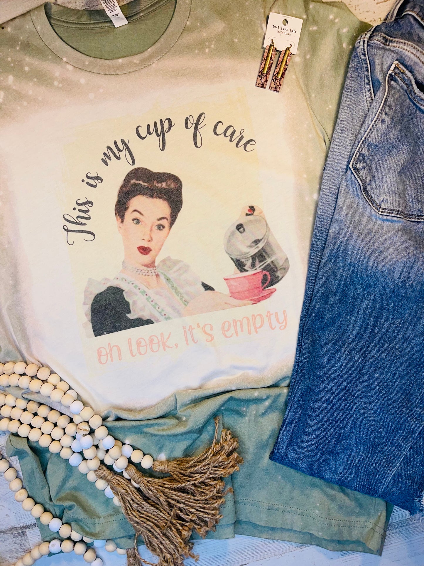 Product details  Custom sublimated tee that reads “Here’s my cup of care, oh look it’s empty" Pressed on a Bella Canva shirt Short sleeve  Fits true to size Contact us about a custom color shirt.   *Colors may vary slightly due to monitor resolution and lighting* Southern Bliss Boutique