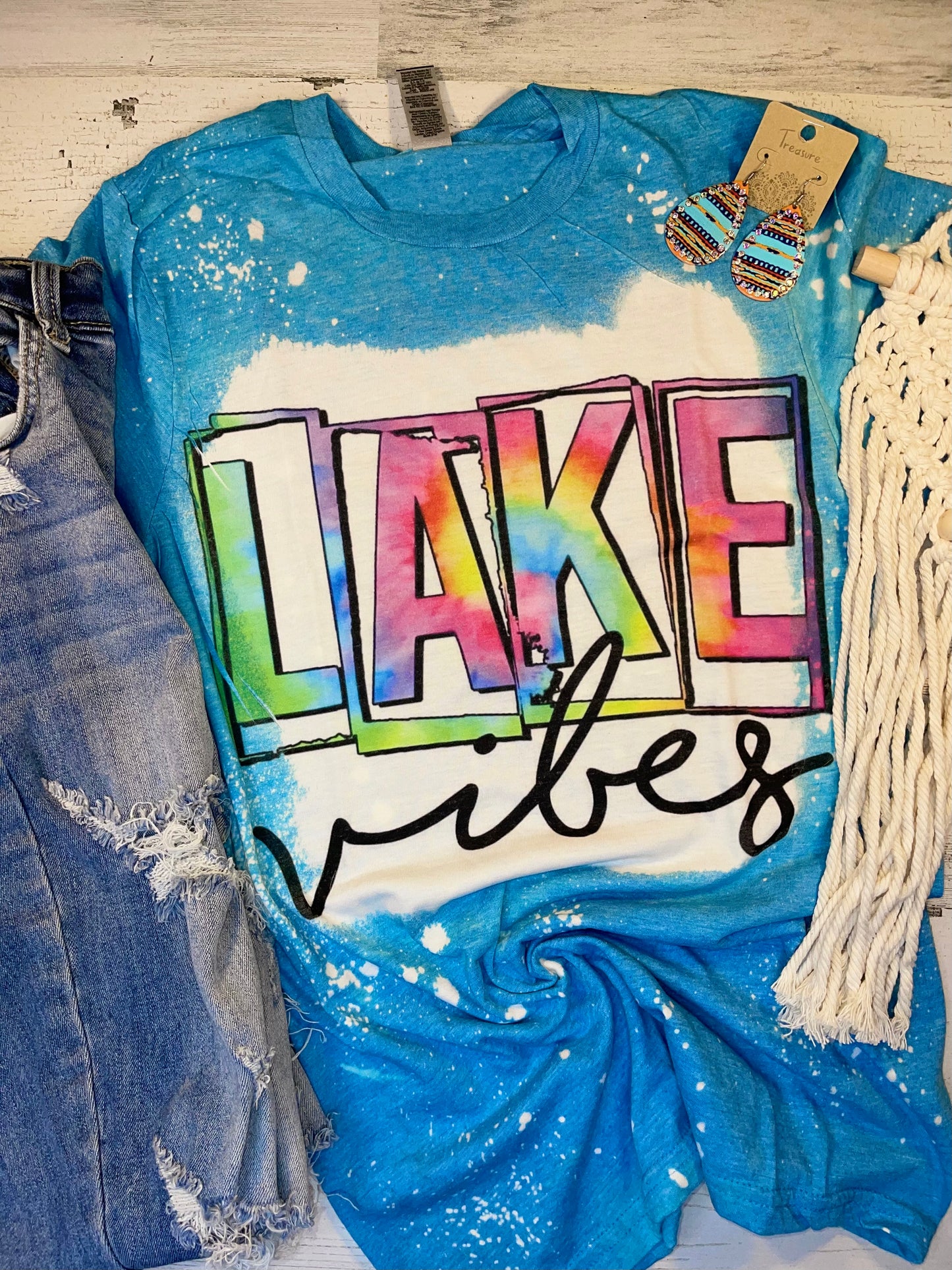 Product details  Custom sublimated tee that reads “Lake Vibes" Pressed on a soft style gildan shirt Short sleeve  Fits true to size Contact us about a custom color shirt.   *Colors may vary slightly due to monitor resolution and lighting* Southern Bliss Boutique 